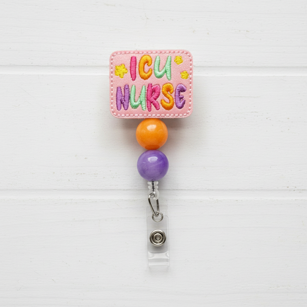 A colorful ICU Nurse badge reel with a pink, green, and yellow design, featuring a clip and retractable cord.