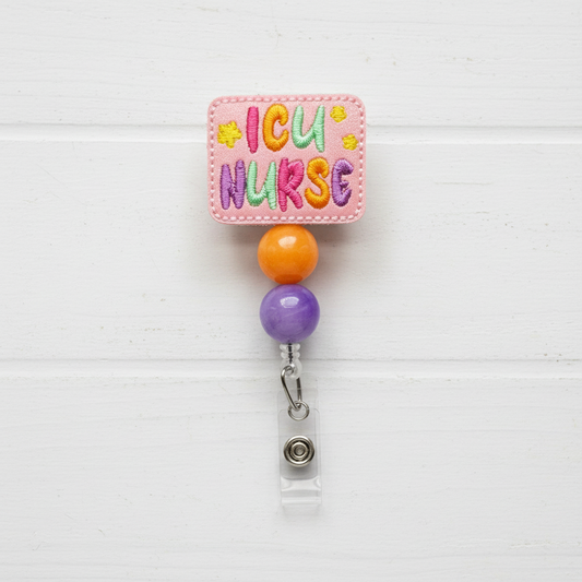 A colorful ICU Nurse badge reel with a pink, green, and yellow design, featuring a clip and retractable cord.