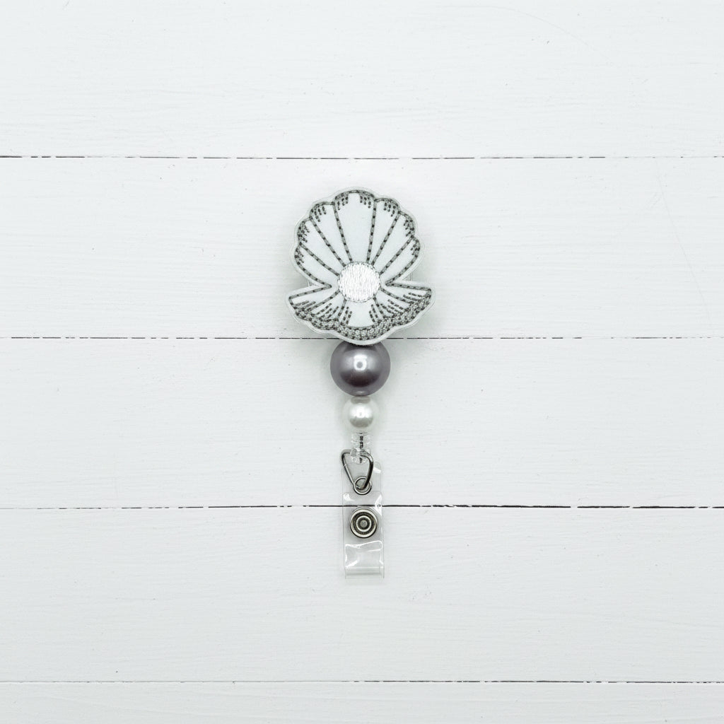 Clam with Pearl Badge Reel