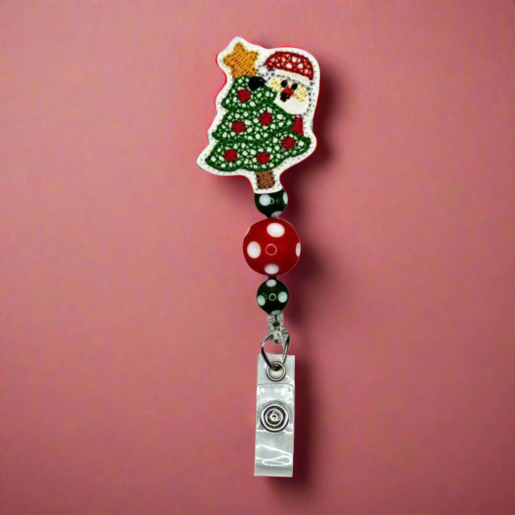 Santa behind Tree Badge Reel