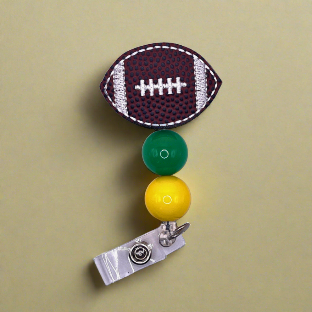 Green and Yellow Football Badge Reel
