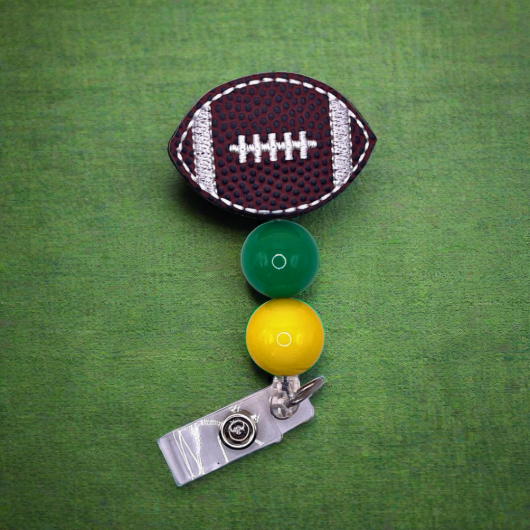 Green and Yellow Football Badge Reel