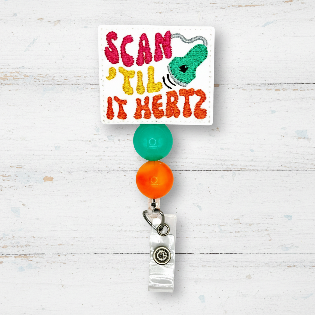 Colorful badge holder with text 'Scan 'Til It Hertz' on a white background