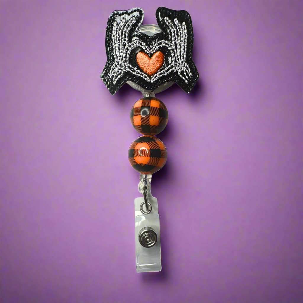 Skeleton Hand Heart Badge Reel