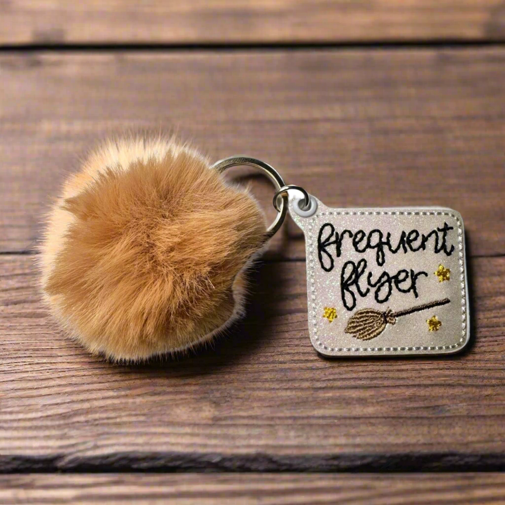 Frequent Flyer Pom Pom Keychain