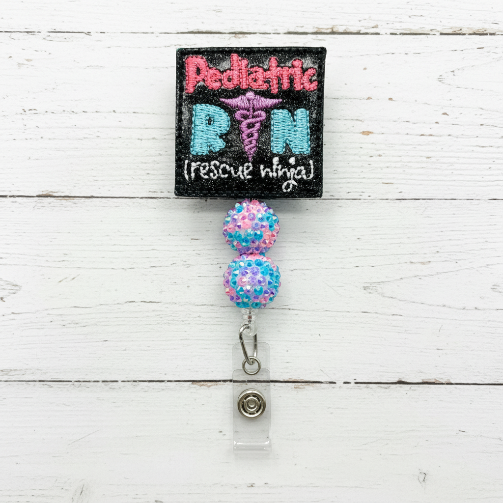 Badge holder with 'Pediatric RN (rescue ninja)' text and colorful beads on a white background