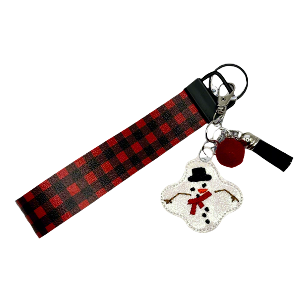 Red and black checkered strap with a snowman charm on a white background