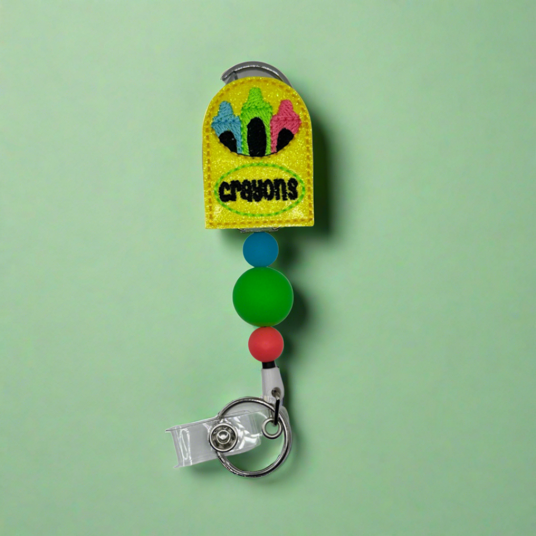 Crayons Badge Reel