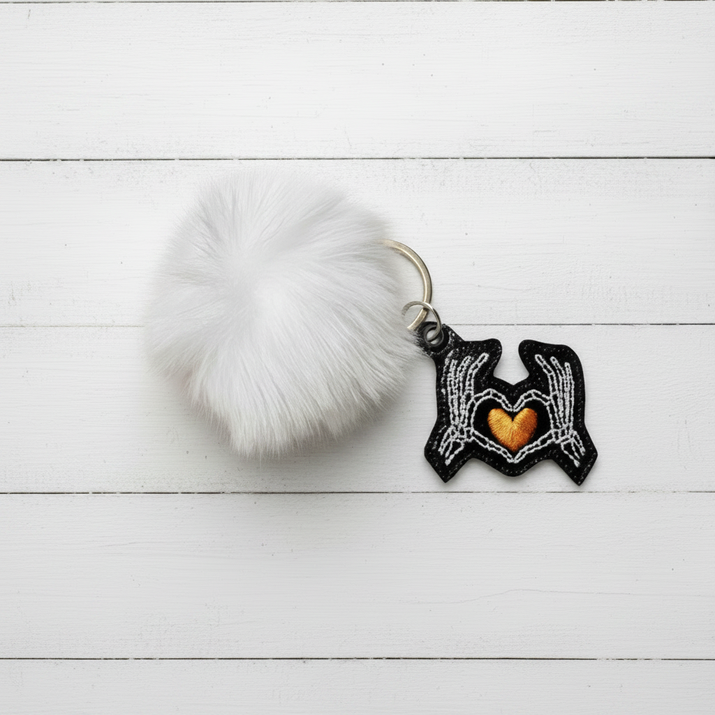 Skeleton Hand Heart Pom Pom Keychain
