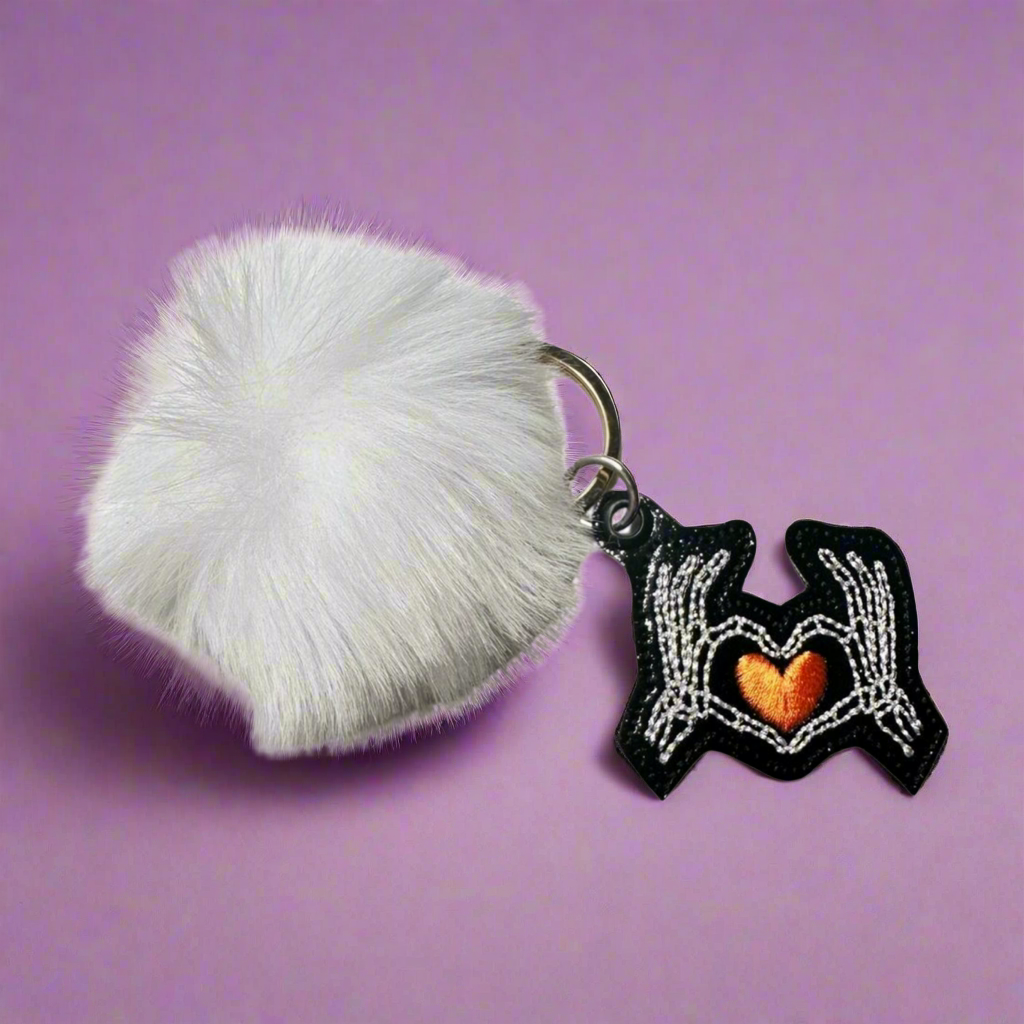 Skeleton Hand Heart Pom Pom Keychain