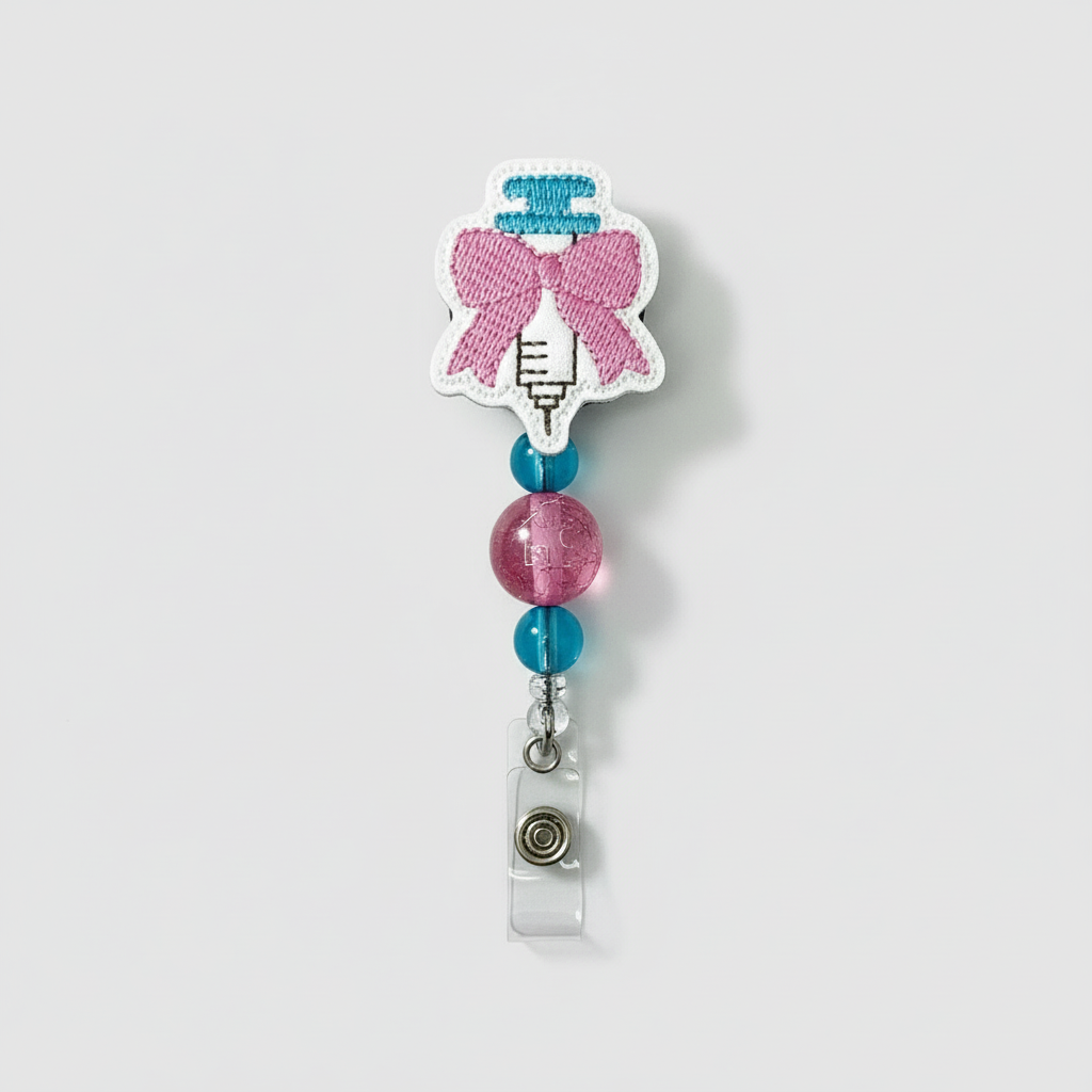 Syringe with bow badge reel