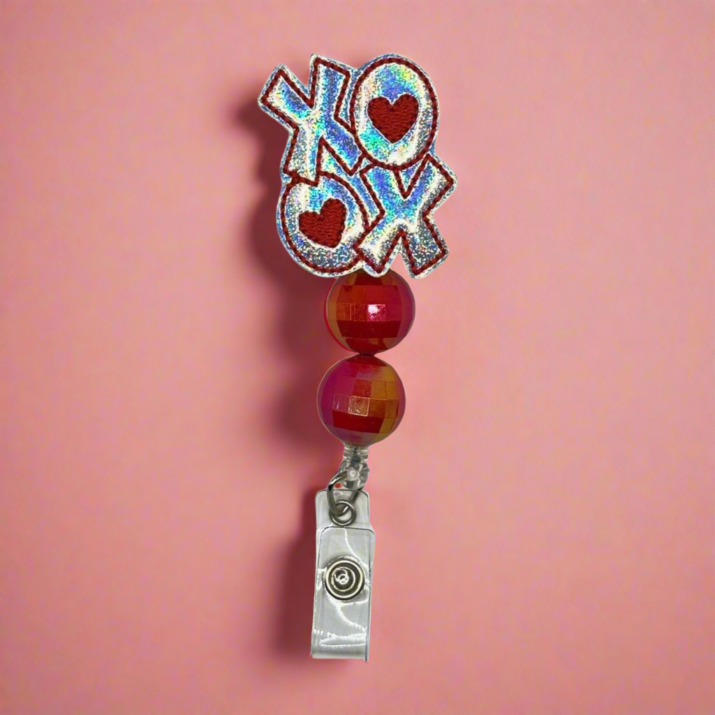 Silver XOXO Badge Reel