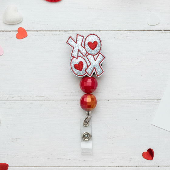 Silver XOXO Badge Reel
