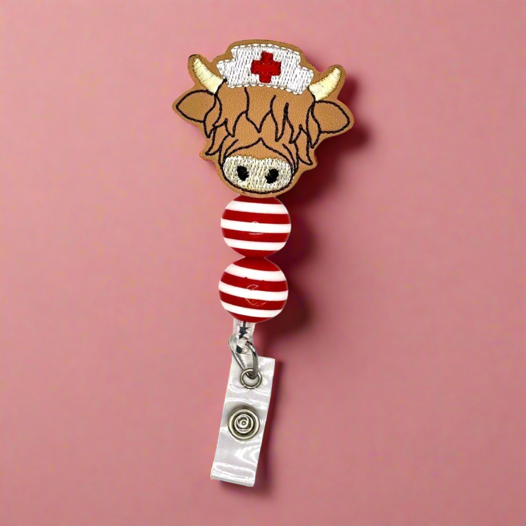 Highland cow nurse badge reel