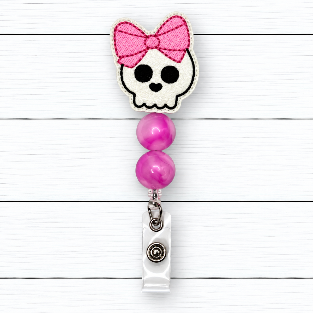 Skull with Bow Halloween Badge Reel