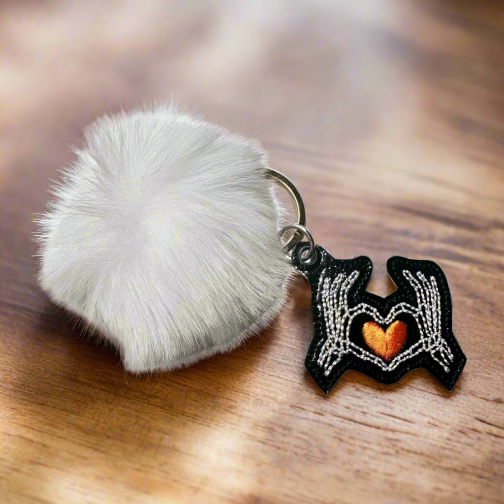 Skeleton Hand Heart Pom Pom Keychain