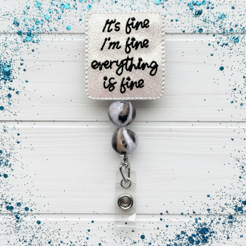 Retractable badge holder with motivational quote on a white background