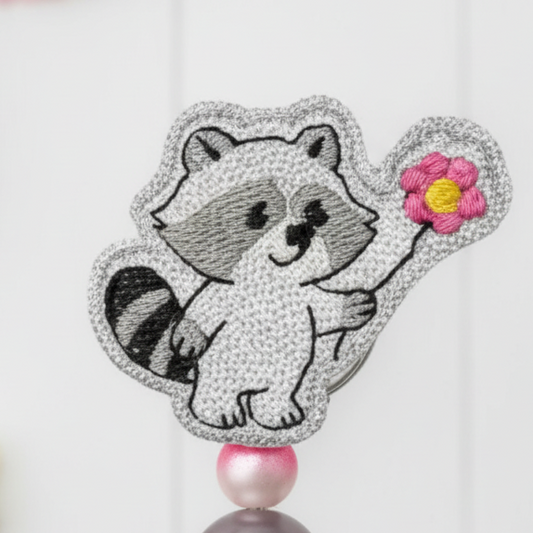 Raccoon with Flower Badge Reel