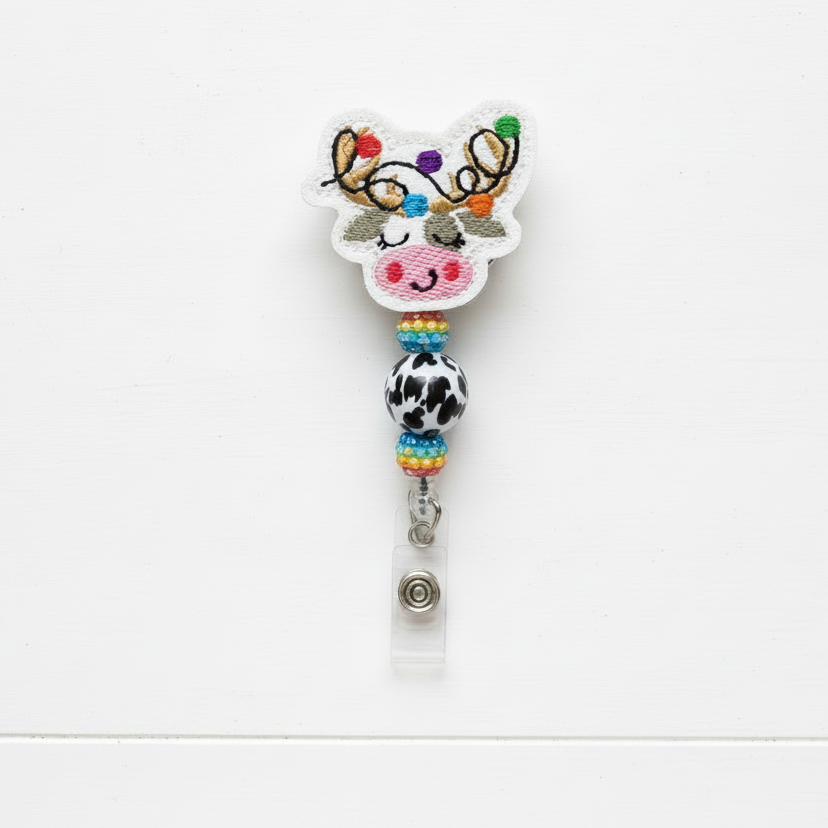 Colorful reindeer-themed keychain with beads on a white background