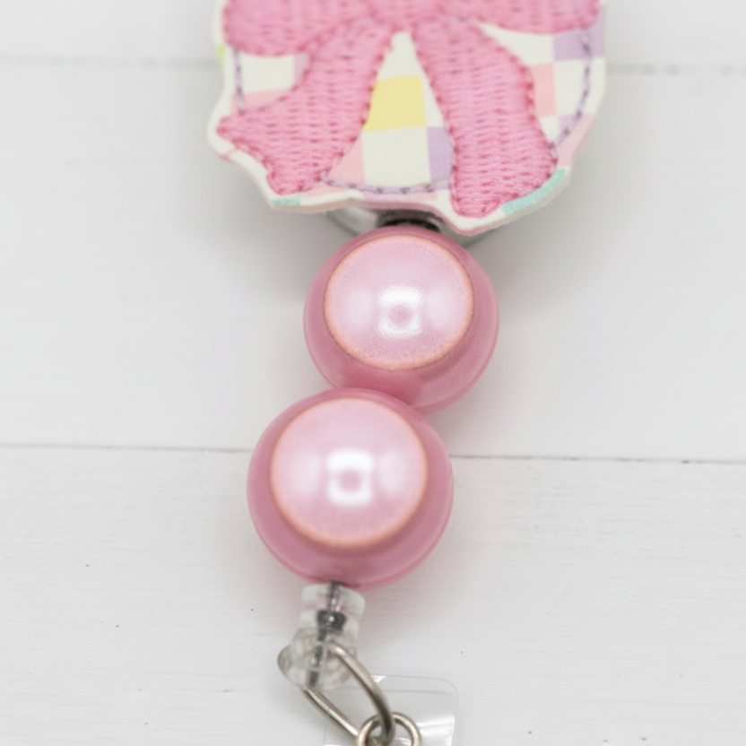 Egg with Bow Badge Reel