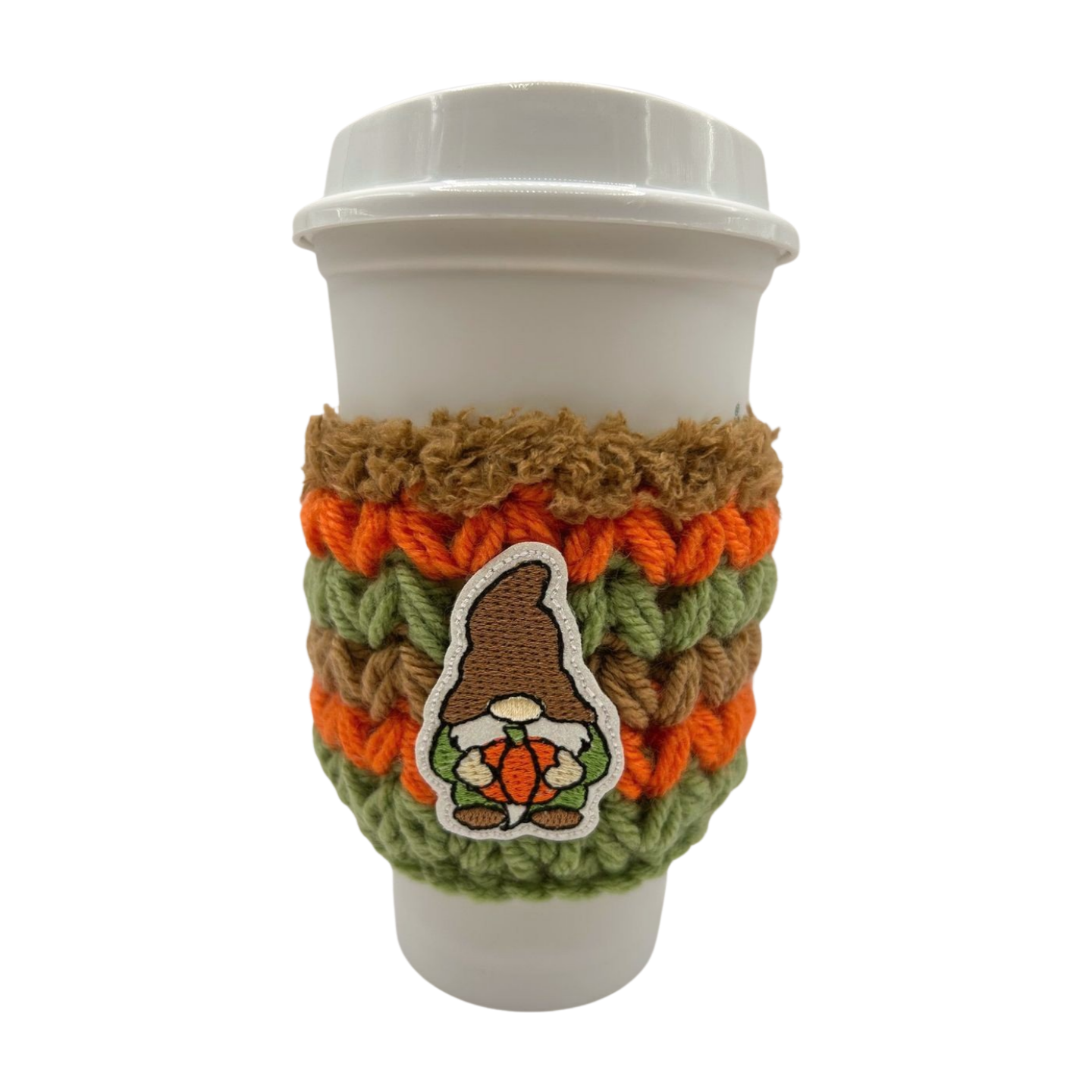 Cup with a knitted sleeve featuring a gnome design on a white background