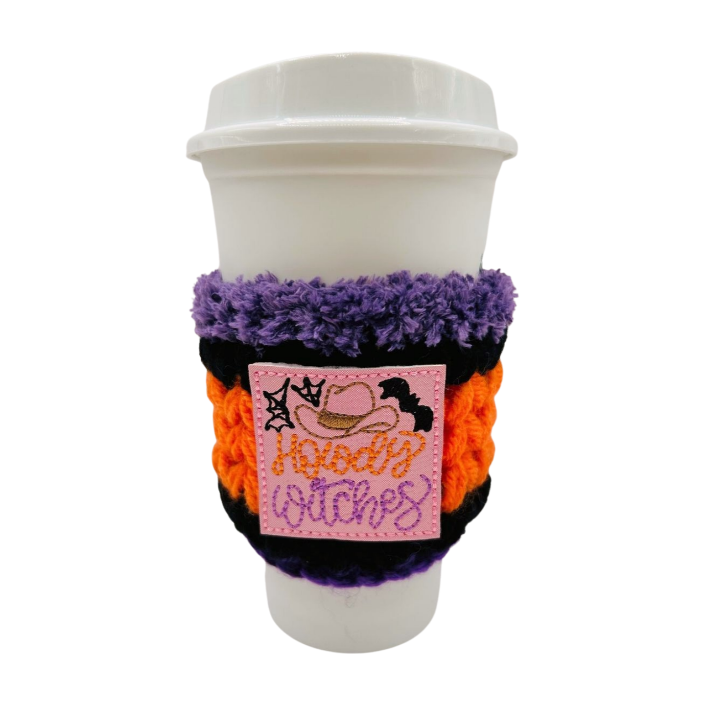 Coffee cup with a purple and orange sleeve featuring a pink label with text on a white background