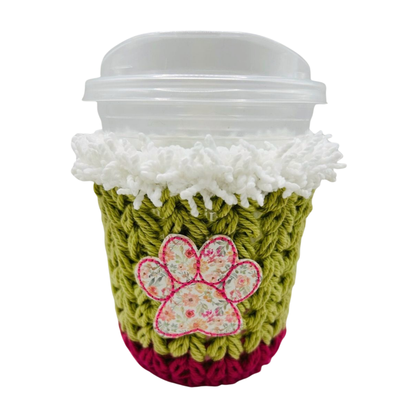 Crocheted coffee cup sleeve with a paw print design on a white background