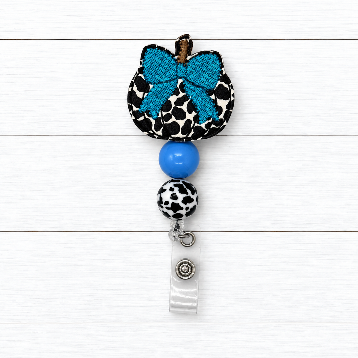 Cow Pumpkin with Bow Badge Reel