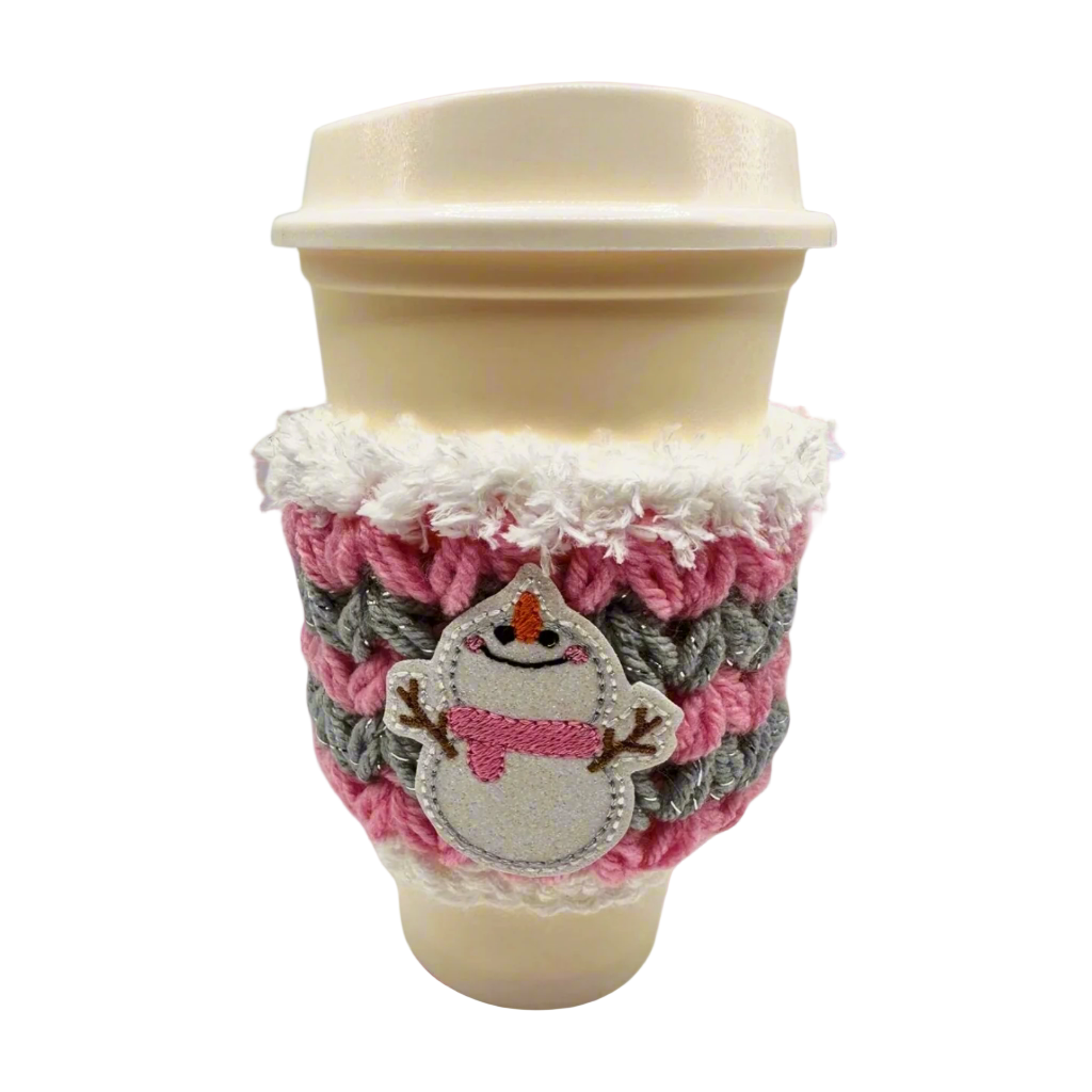 A coffee cozy sleeve with a snowman design, primarily in blue and gray tones, wrapped around a coffee cup.