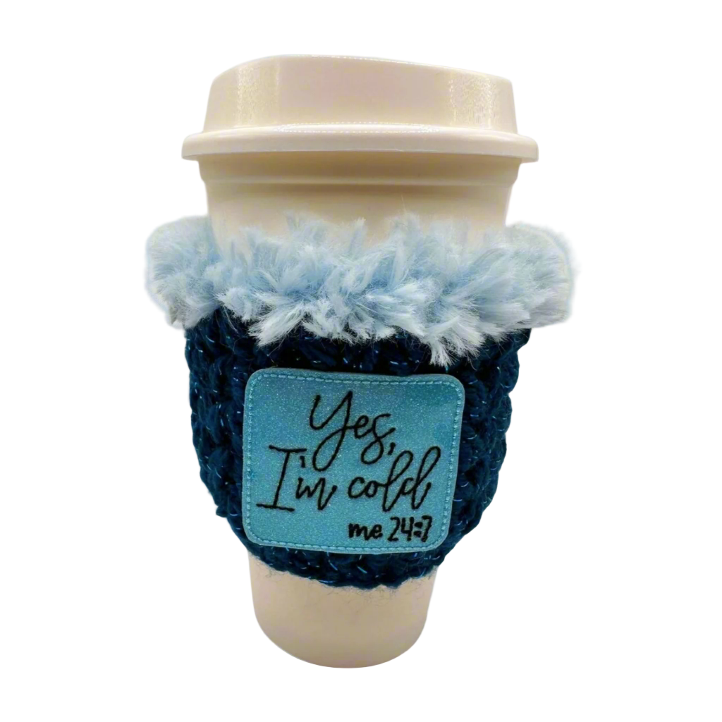 Coffee cup with a blue and white cozy featuring text on a white background