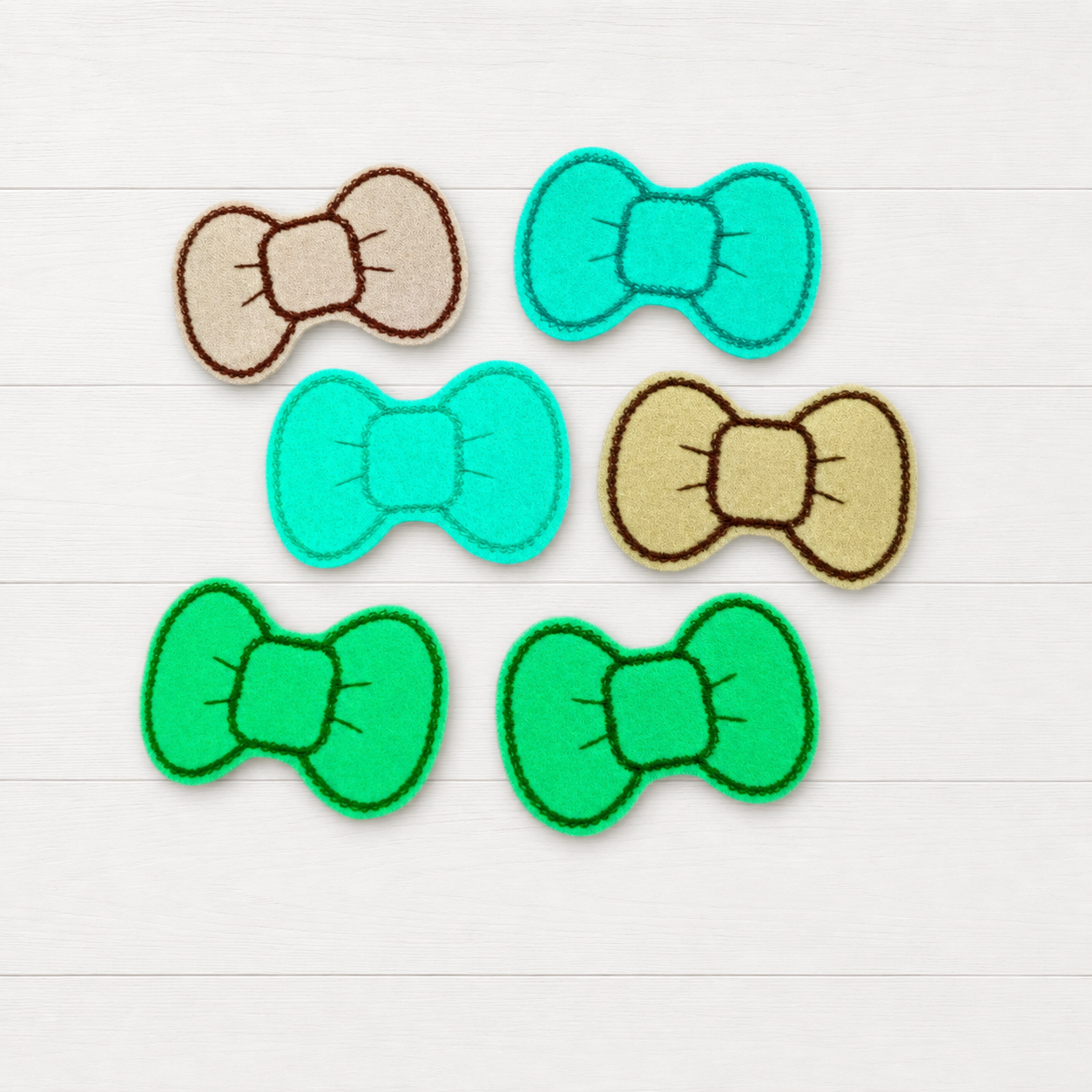Glow in the Dark Hair Bow Clips on a clean white wood background