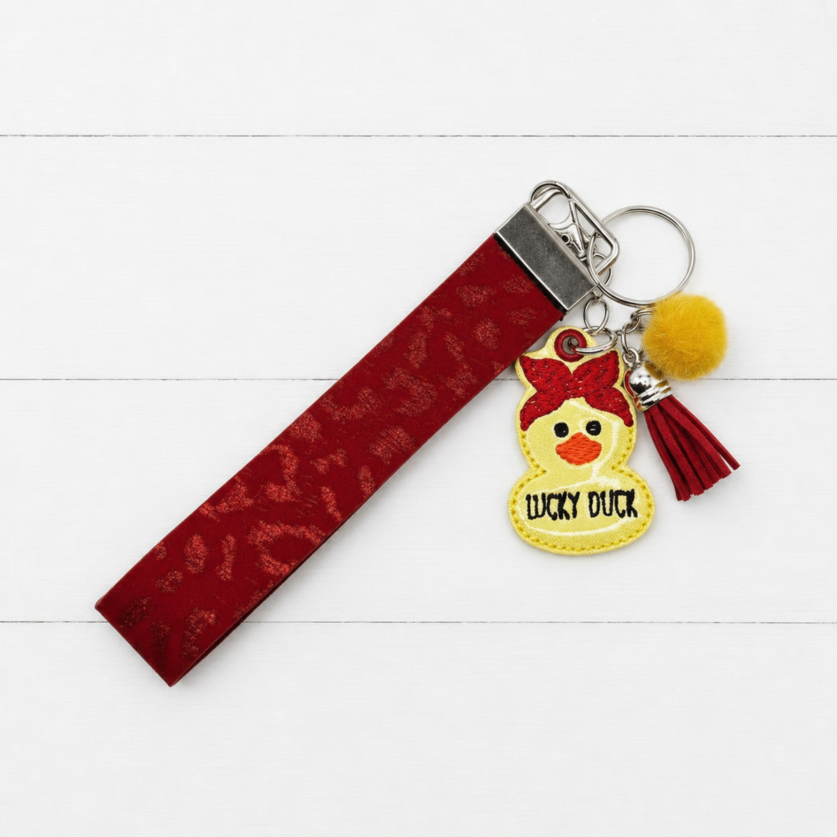 Lucky Duck Keychain and Wristlet — clean white wood primary image