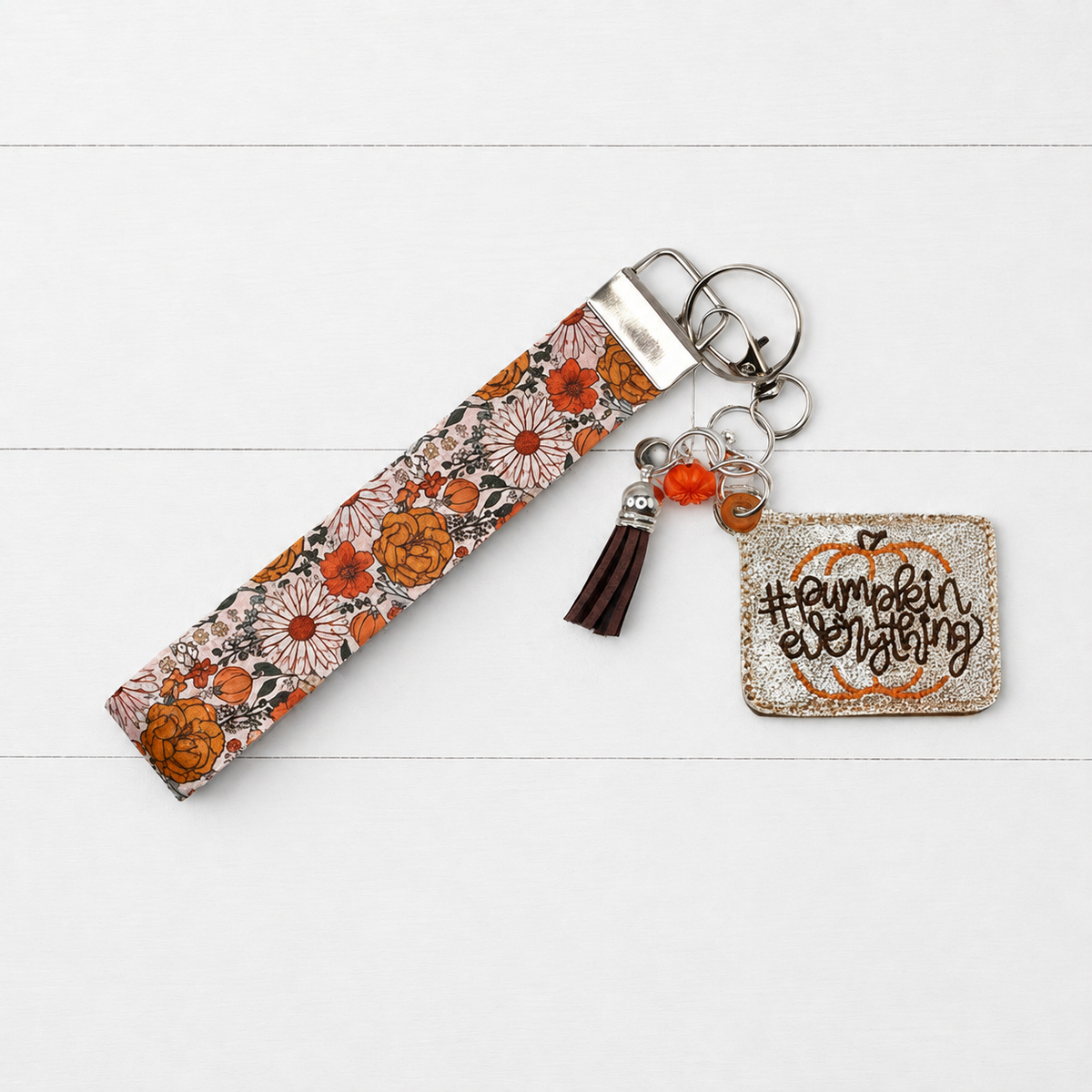 Pumpkin everything Keychain and wristlet on clean white wood background