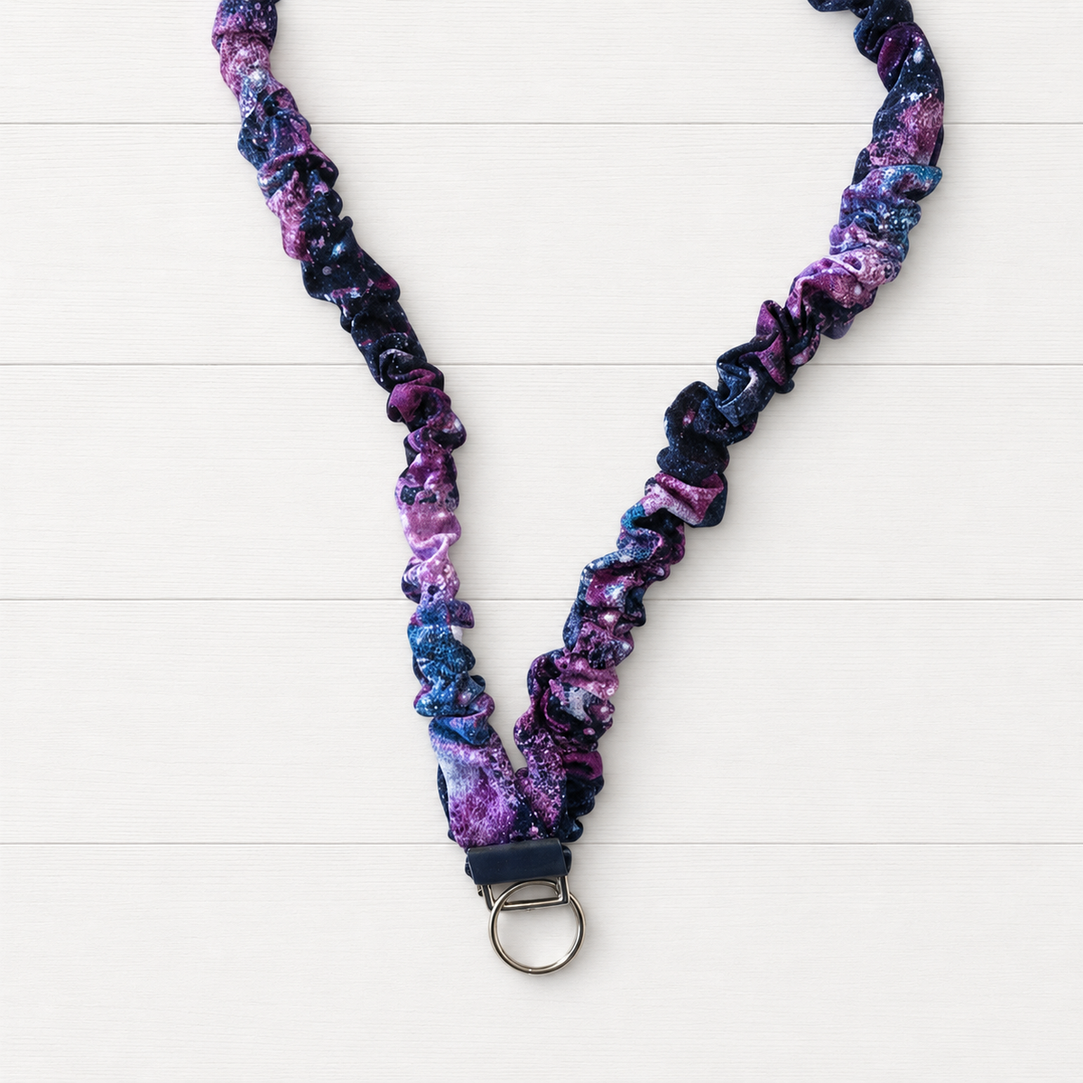 Space Scrunchie Lanyard on a clean white wood background