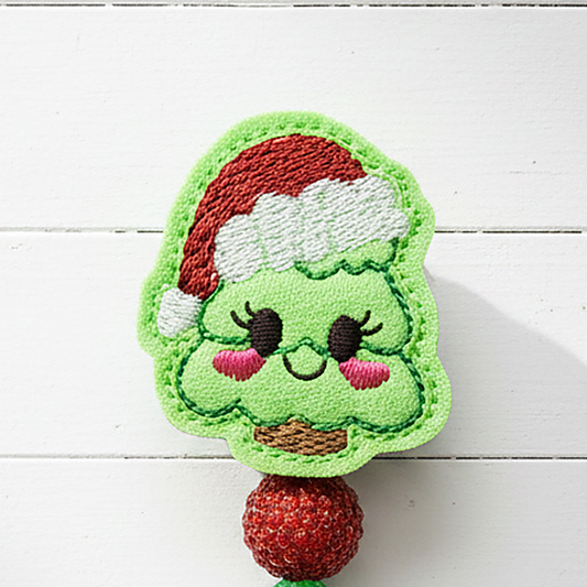 Tree with Santa Hat Badge Reel