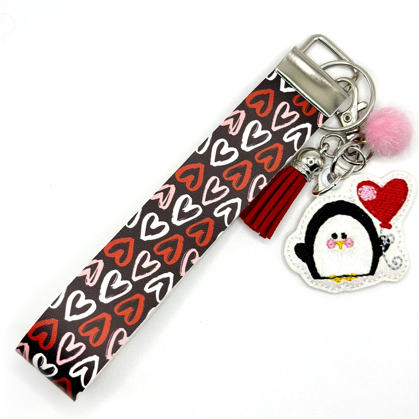Loving penguin keychain and wristlet