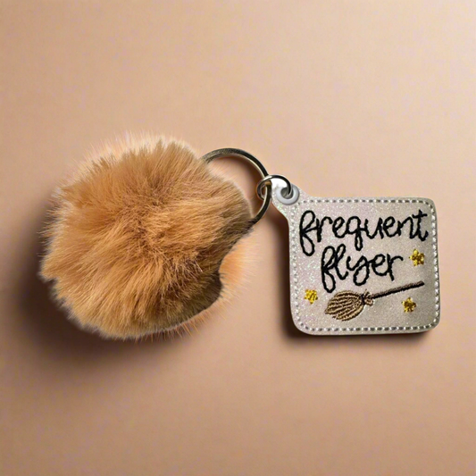 Frequent Flyer Pom Pom Keychain