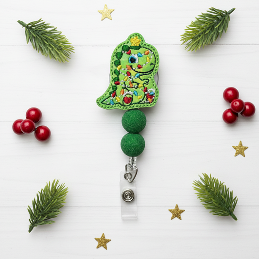 Decorative green badge holder with floral design on a white background