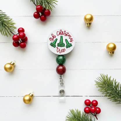 Christmas-themed badge holder with 'Oh Christmas Tree' text and green trees on a white background