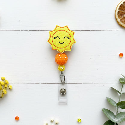 Smiling Sun Badge Reel