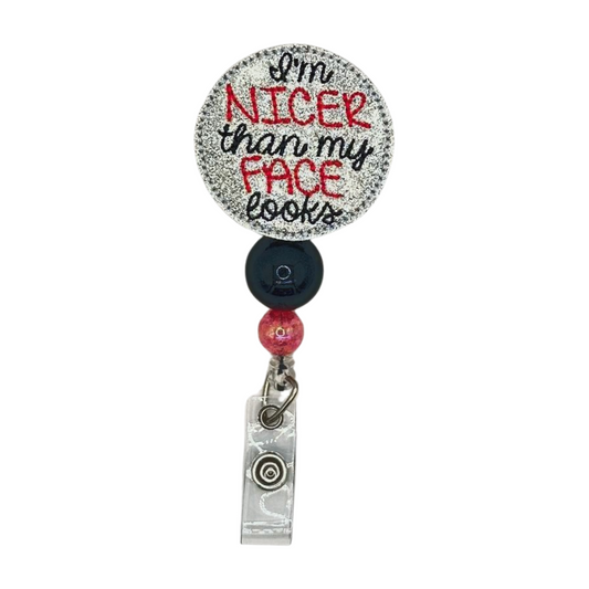 I’m nicer than my face looks badge reel