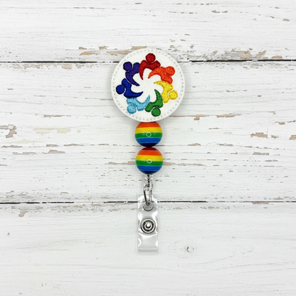 Colorful badge holder with rainbow design on a white background