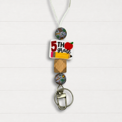 5th Grade Lanyard on a clean white wood background