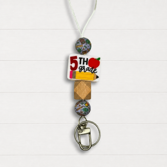 5th Grade Lanyard on a clean white wood background
