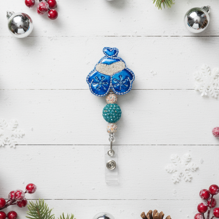 Decorative badge holder with blue and white design on a white background