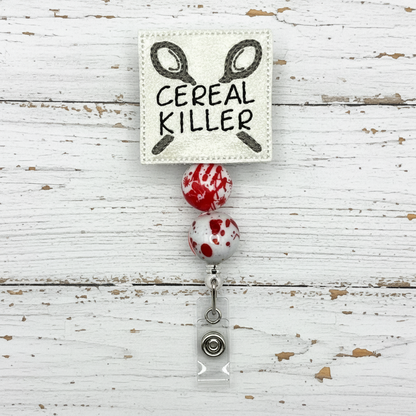 Badge holder with 'Cereal Killer' text and blood-stained design on a white background
