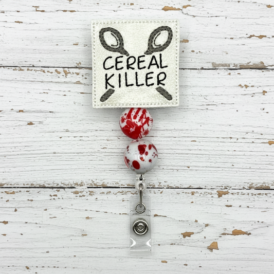 Badge holder with 'Cereal Killer' text and blood-stained design on a white background