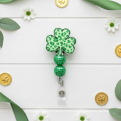 Green shamrock-shaped badge holder on a white background