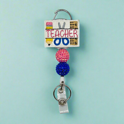 Teacher With Supplies Badge Reel