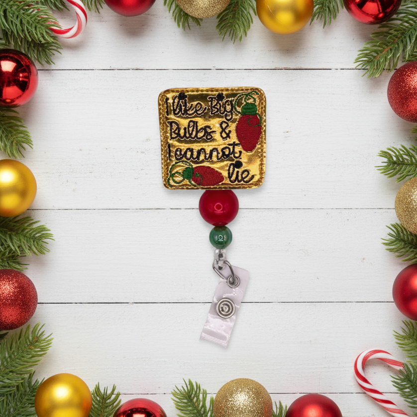 Decorative badge with text and ribbons surrounded by Christmas ornaments and lights on a white wooden background.